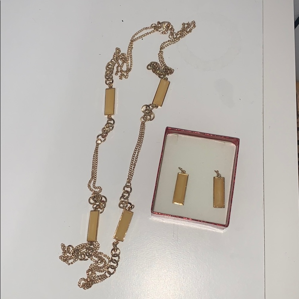 Long gold necklace with matching earrings